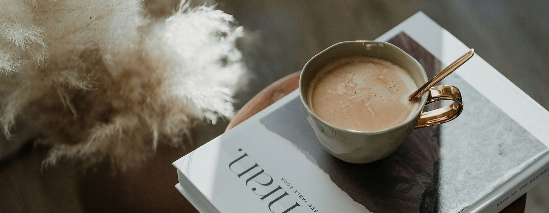 a cup of coffee on a book