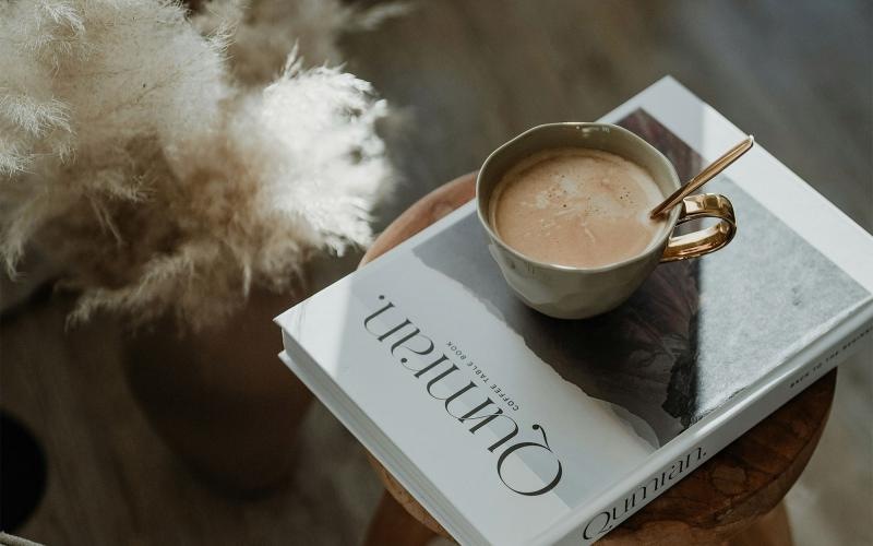 a cup of coffee on a book
